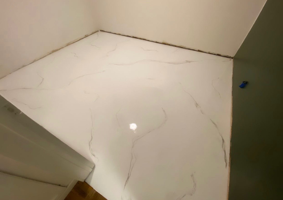 White marble-style epoxy floor by Calpoxy